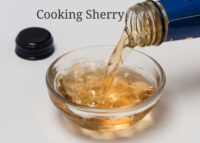 cup of cooking sherry being poured out of a bottle